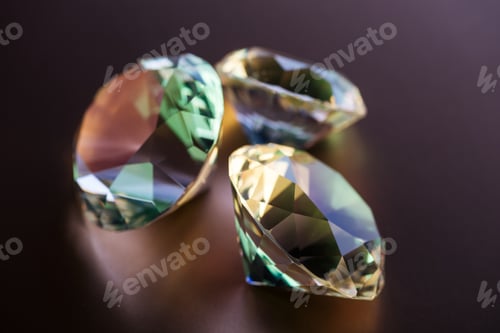 Preview: collection of shiny big diamonds on brown background