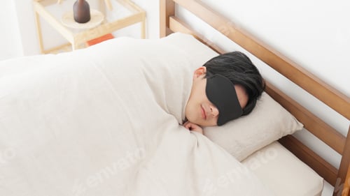 Preview: A man sleeps with an eye mask in a bright room