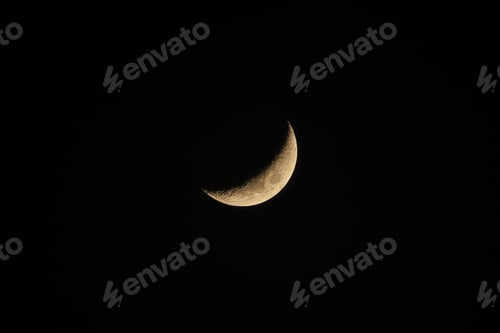 Preview: Closeup of waxing crescent moon isolated on a dark night sky