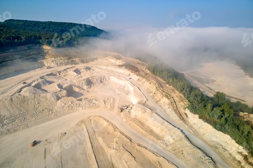 Preview: Aerial view of open pit mining of limestone materials for construction industry with excavators and