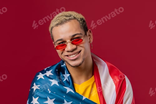 Preview: Happy man with national USA flag on red background. American patriot, 4th of July - Independence day