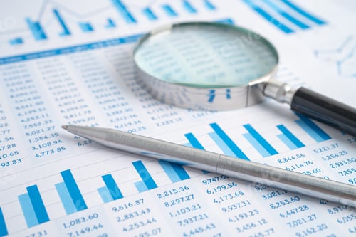 Preview: Magnifying glass on charts graphs paper. Financial development, Banking Account, Statistics,