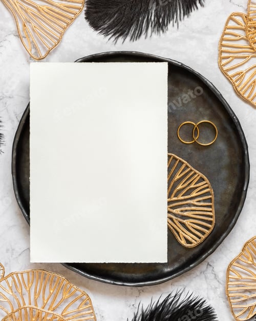 Preview: Black and golden wedding table setting with a blank card and rings top view, mockup
