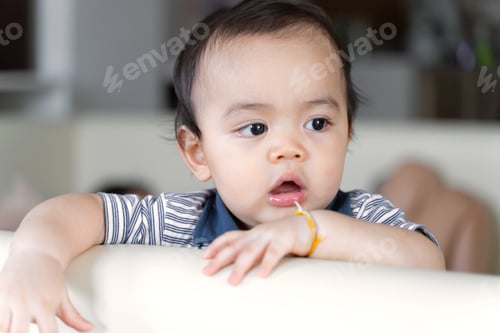 Preview: Portrait of little kid looking at camera, Close up little kid play and and enjoying time and shocked
