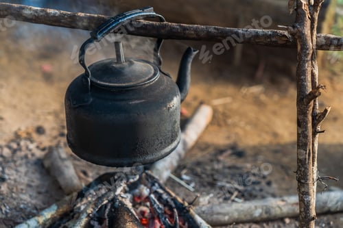Preview: Pot boiled over fire wood burn on camping