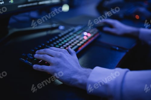 Preview: Cropped view of man playing video game on computer on cyber club