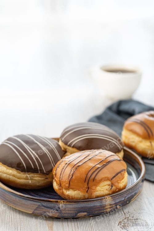 Preview: Donut or bun made from sweet yeast dough stuffed with chocolate or cream with icing.