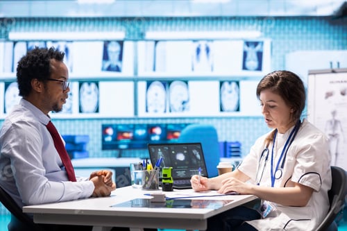Preview: General practitioner prescribing antibiotics and vitamins for a patient