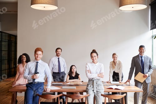 Preview: Young professionals at a business meeting looking to camera