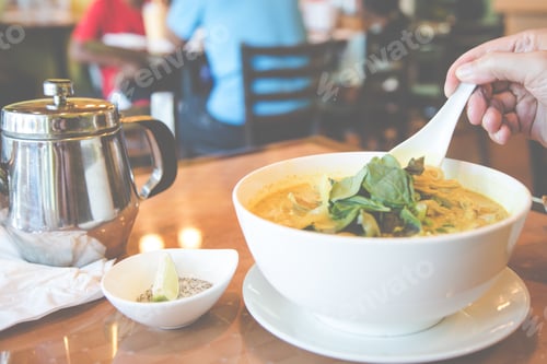 Bowl of Asian Soup with Teapot