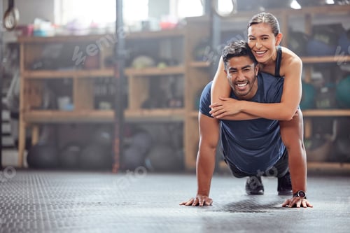 Preview: Fitness couple having fun while man does push ups and exercise together at the gym. Healthy, fit an