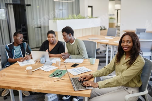 Preview: Black Businesswoman Typing on Laptop
