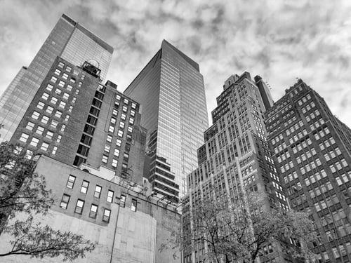 Preview: Low-angle shot of tall skyscrapers against the cloudy sky