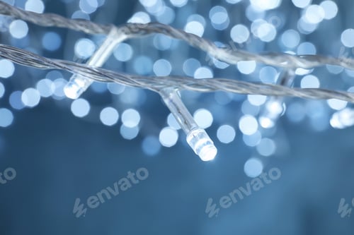 Preview: Beautiful Christmas lights on color background, closeup