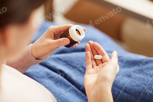 Preview: Woman taking a pill