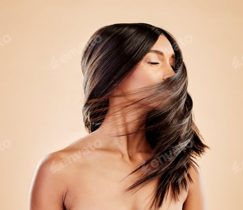 Preview: Woman, beauty and shake hair in studio for aesthetic shine, volume and smooth shampoo results. Indi