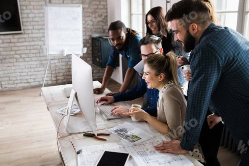 Preview: Young architects working on project in office