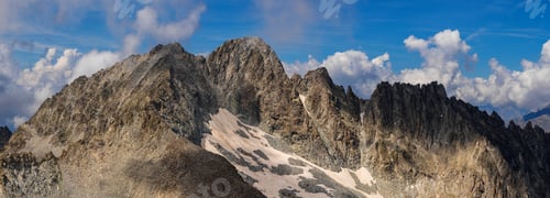 Preview: Panoramic View of Rocky Mountain Range with Clouds
