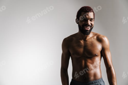 Preview: Black shirtless sportsman smiling and looking aside