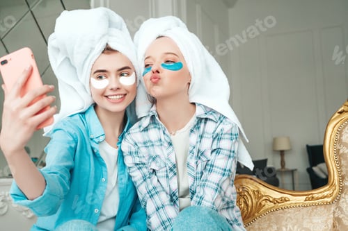 Preview: Two beautiful women posing in white interior