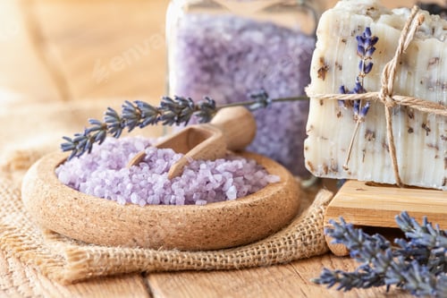 Preview: lavender oil and salt in glass bottle on background of dry lavender flowers. Natural cosmetic