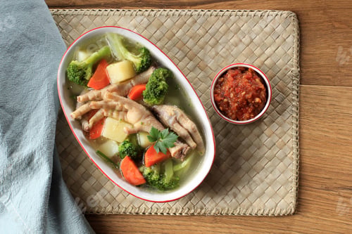 Preview: Chicken Feet (Ceker) on Vegetable Clear Soup with Potato, Broccoli, and Carrots.