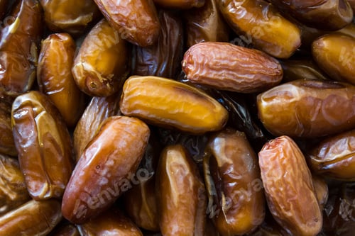 Preview: Close-up of fresh medjool dates showing texture and detail