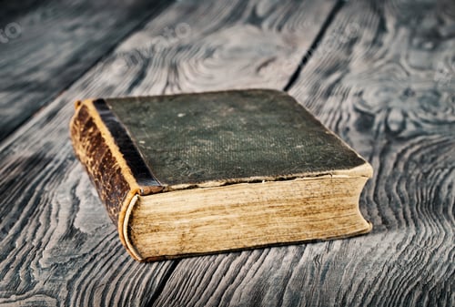 Preview: Ancient closed book with green cover