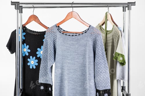 Preview: Stylish Knitted Sweaters on a Clothes Rack