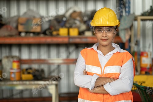 Preview: Portrait of smart women worker Asian race with protective safety suit standing smile