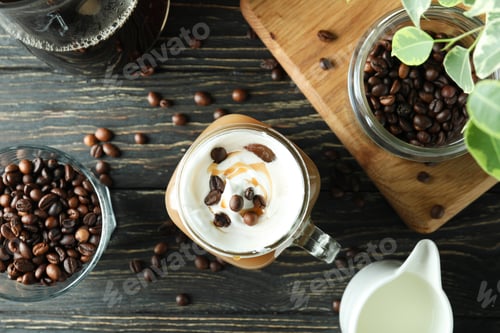 Preview: Concept of cold drink with ice coffee on wooden table
