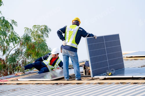 Preview: workers installing solar panels, for efficient energy on rooftop
