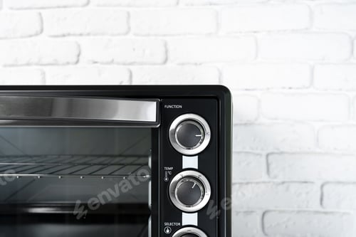 Preview: Close up of black mini electric oven home appliance