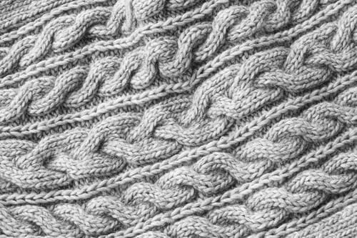 Preview: Gray knitted texture. Handmade Knitwear, creative background