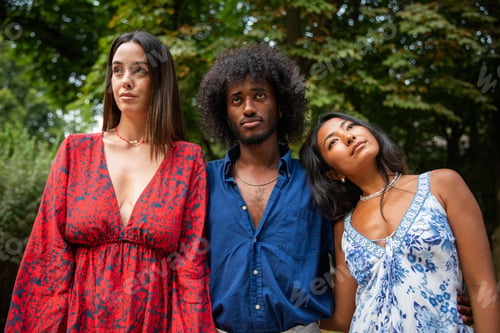 Preview: Three young adults of different ethnicities look forward thoughtfully, they think about the future.