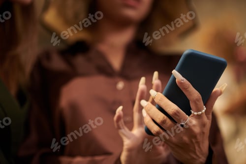 Preview: Woman texting message on smartphone