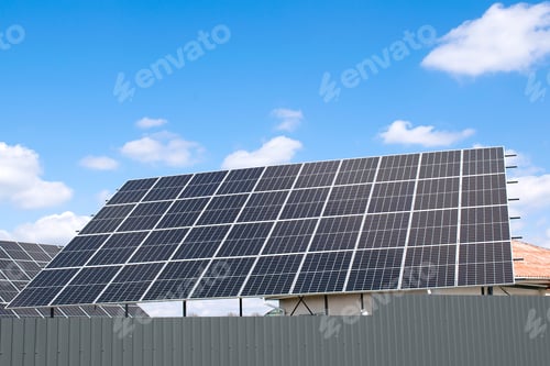 Preview: view of new modern residential house cottage with blue shiny solar photo voltaic panels system