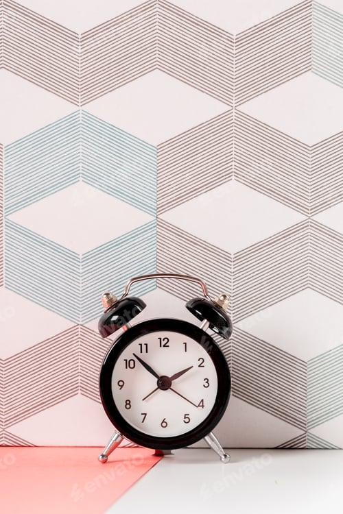 Preview: Vintage background with retro alarm clock on table