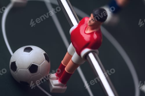 Preview: closeup of football figurine on foosball table soccer game