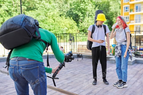 Preview: Videographer filming teen models on city