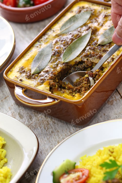 Preview: bobotie is a curry flavored meatloaf with baked egg on top.