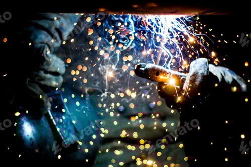 Preview: Person welding at a construction site