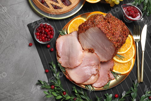 Preview: Flat lay composition with delicious ham for Christmas dinner on grey table