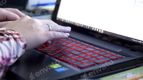 Preview: Close-up Of A Woman Working On Laptop At Workplace. Close up woman hands using laptop for her work