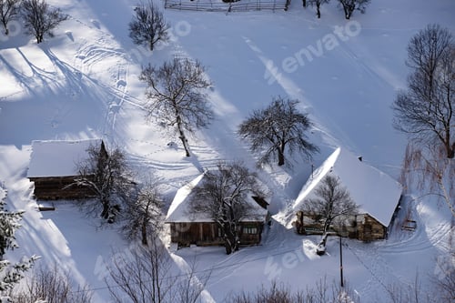 Preview: Snowy Landscape with Cabins and Bare Trees