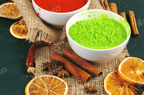 Preview: Traditional Indian Holi colours powder, spices on dark rustic background