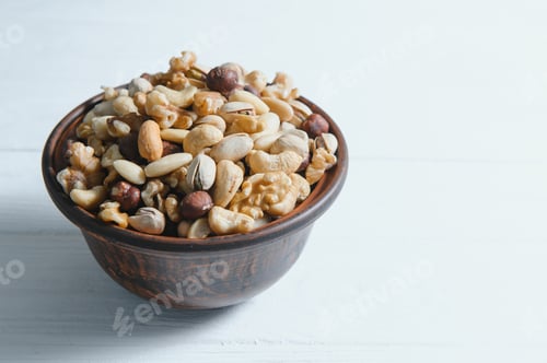 Preview: Bowl of Mixed Nuts on White Wooden Surface