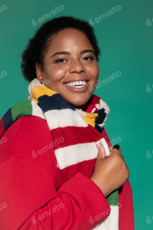 Preview: Stylish plus-size woman confidently showcases trendy autumn fashion in a studio