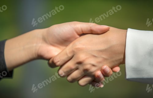 Preview: , business team touching hands together after complete a deal in meeting.