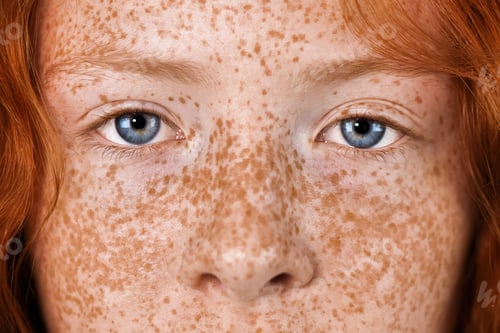 Preview: Portrait of a red-haired girl with freckles